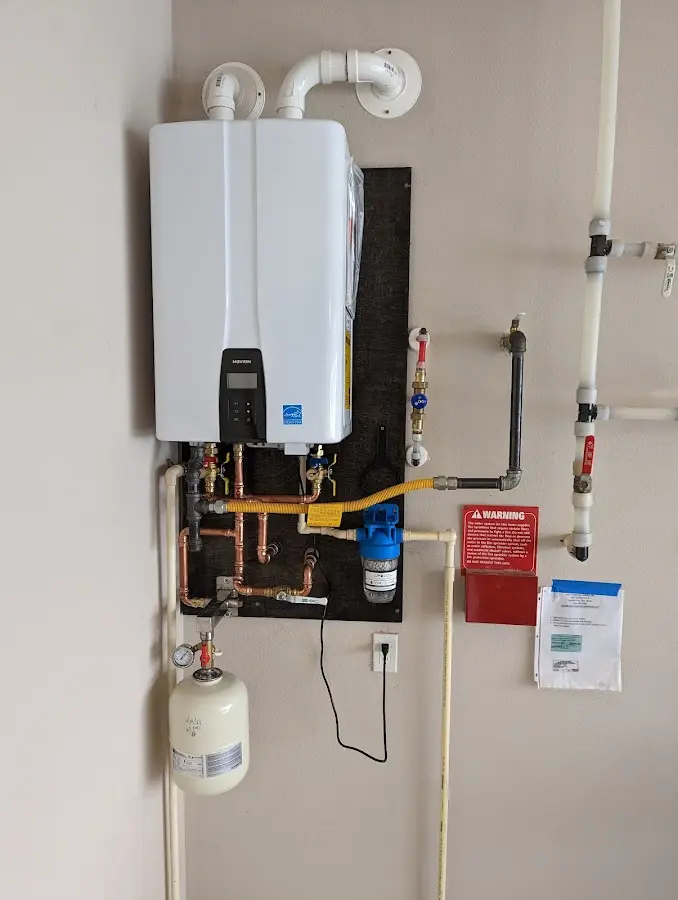 Professional plumber installing copper piping in a Nowata home